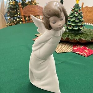 Lladro Curious Angel figurine
